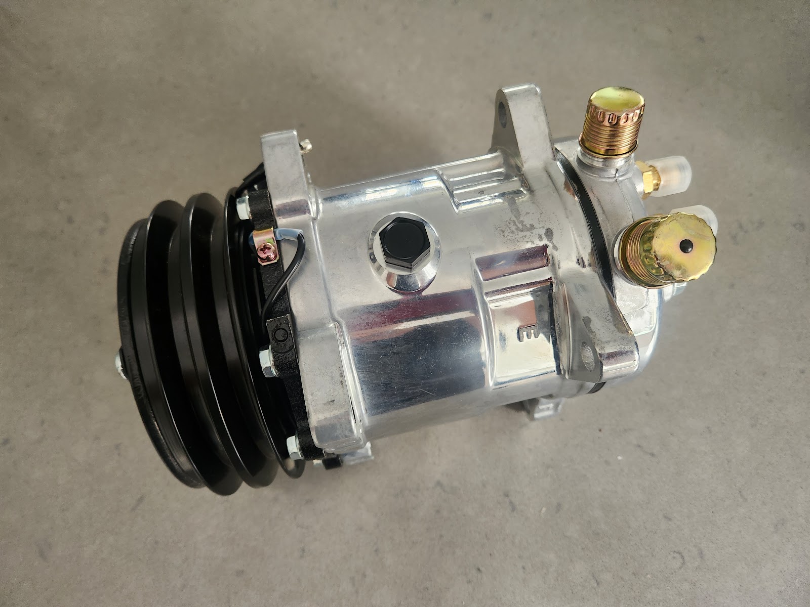 A new air conditioning compressor ready to be fitted