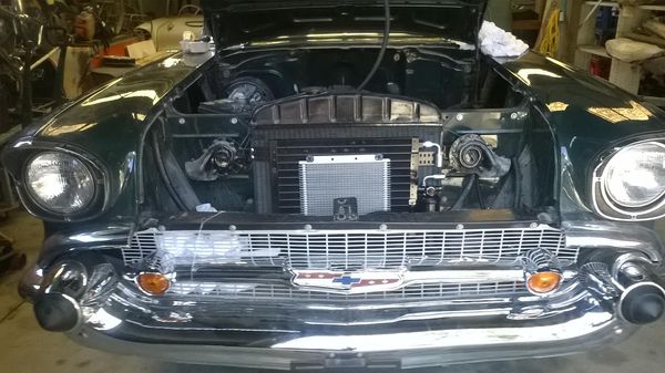 The front end of a classic Chevrolet with the bonnet up